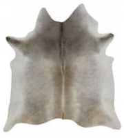Cowhide rug with a natural pattern on a plain background